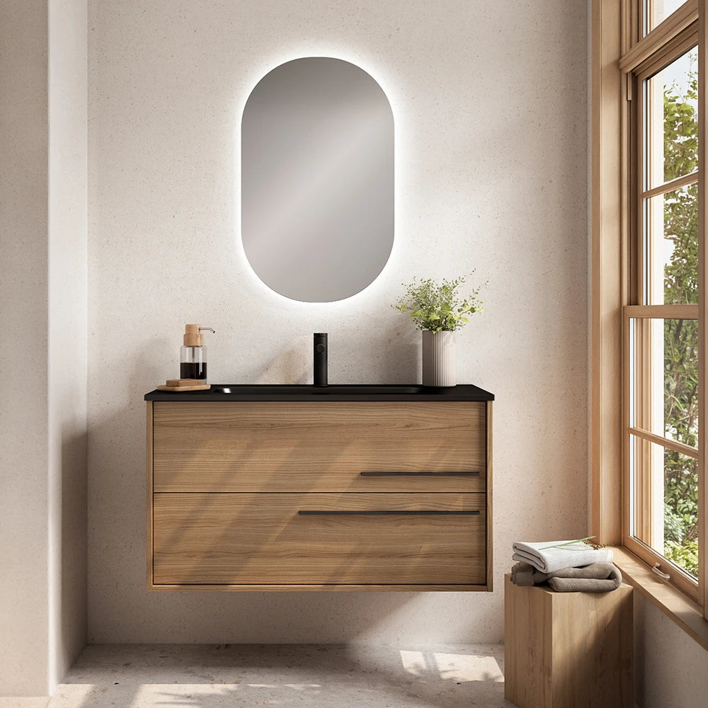 Mobile bagno sospeso in legno con due cassetti, top nero e specchio ovale retroilluminato